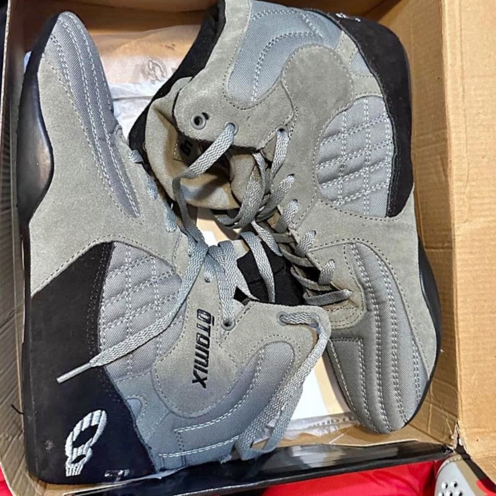 Men lifting athletic training shoe